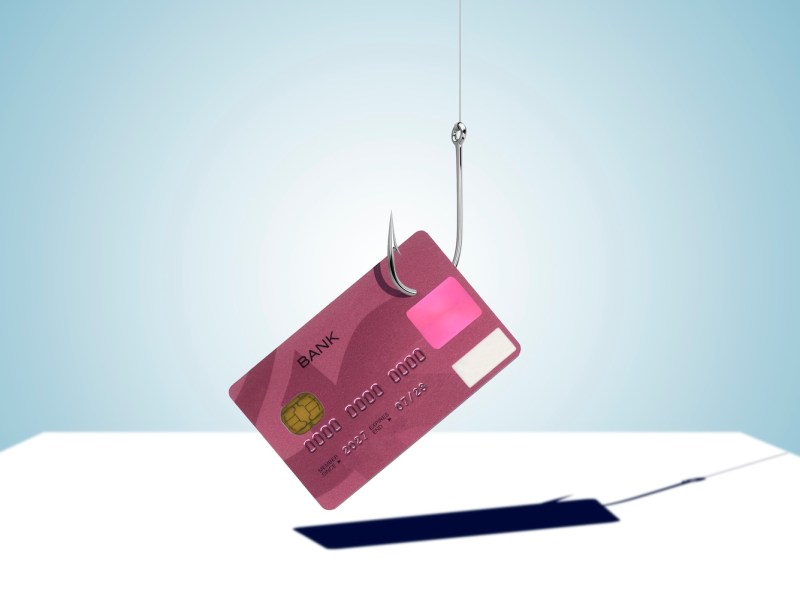Kreditkarte ist an einem Angelhaken befestigt.