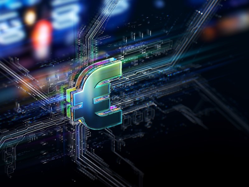 Das Euro-Zeichen vor futuristischem Hintergrund.